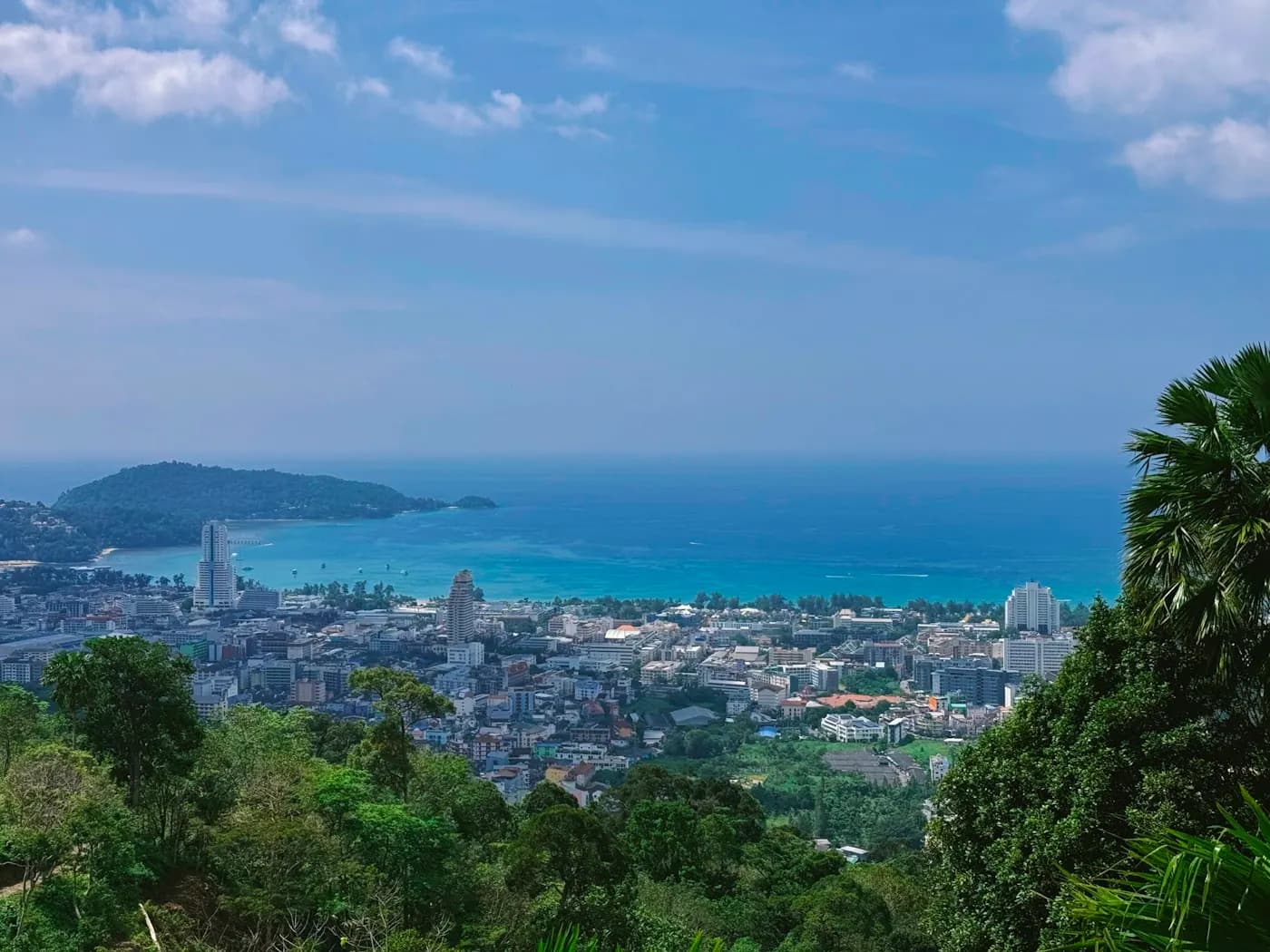 The coastline and green hills of Phuket seen from a viewpoint