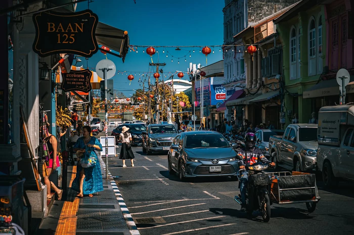 Lanterns, shophouses and street traffic in Phuket Old Town