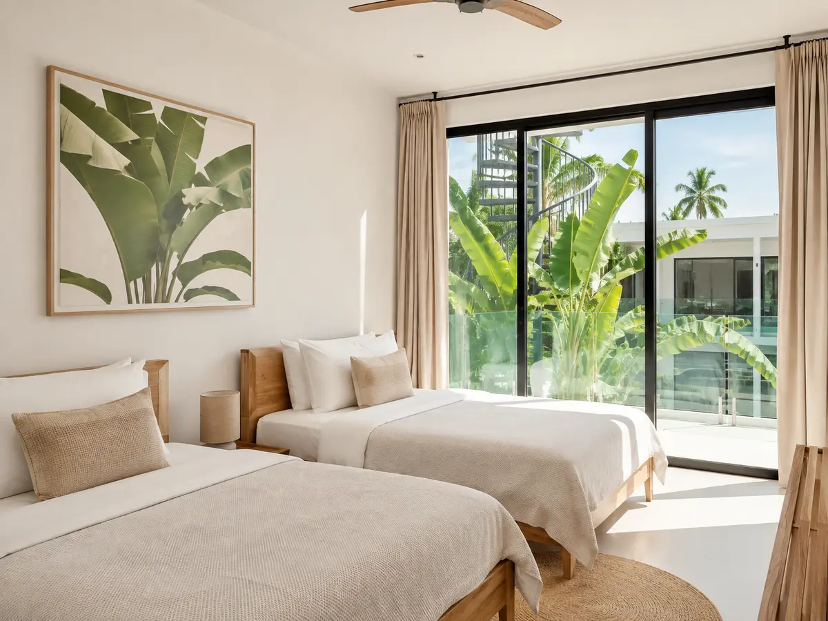 Light-filled twin room with tropical greenery outside