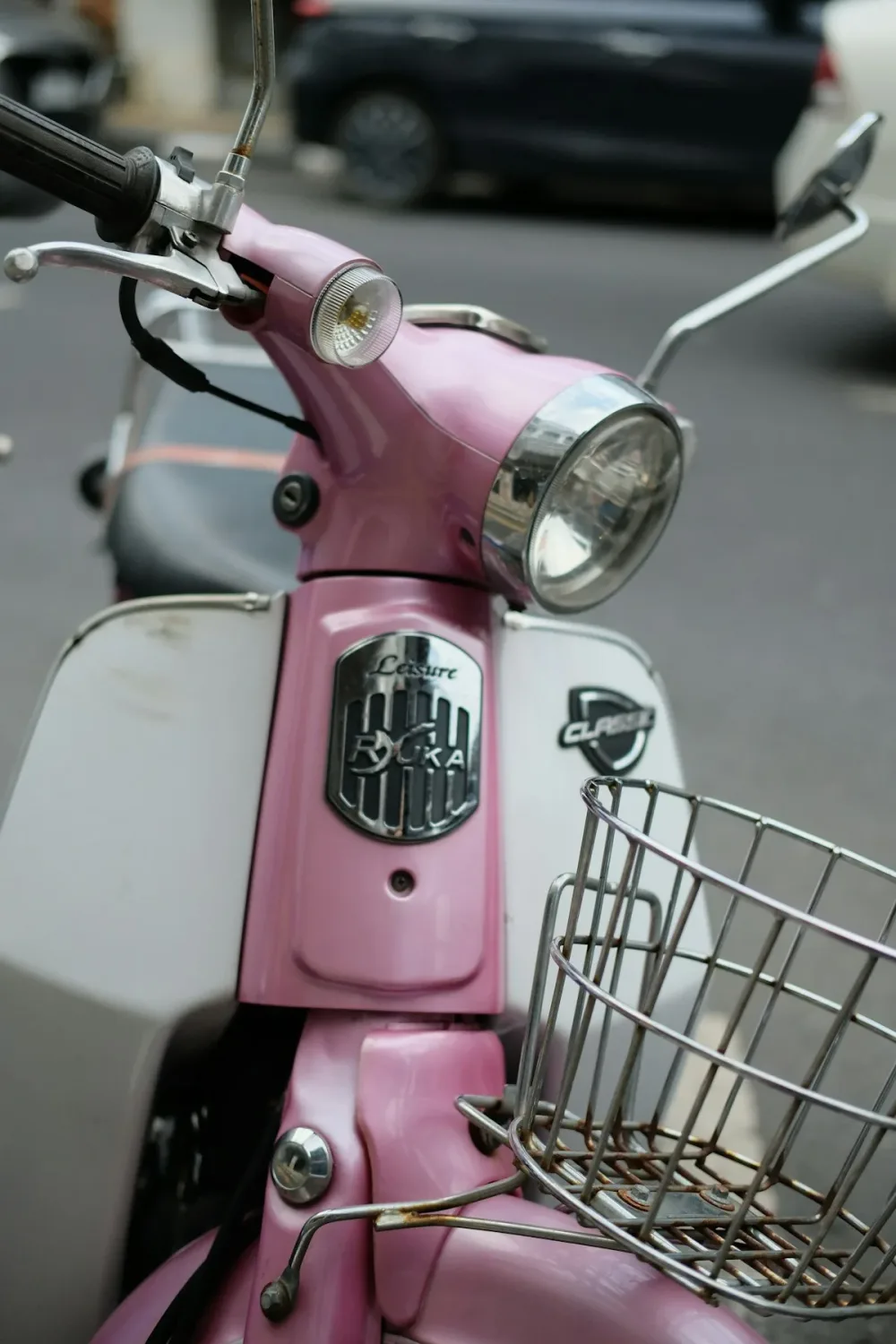 A parked pink scooter in Phuket Old Town